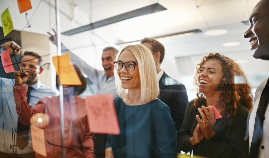 teamwork brainstorming session with diverse colleagues using sticky notes
