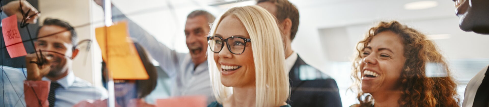 teamwork brainstorming session with diverse colleagues using sticky notes