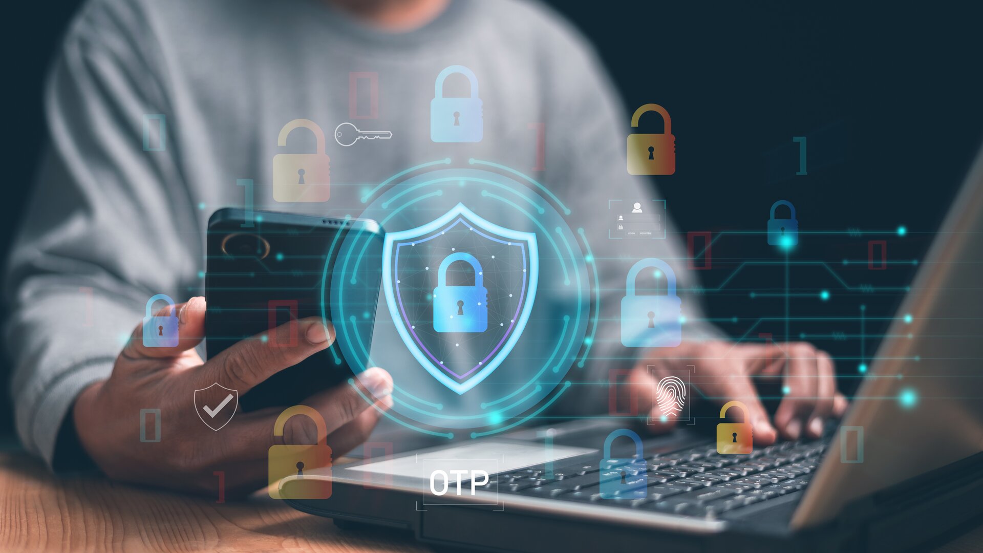 Weiterbildung Schutz vor Cybercrime und Existenzbedrohung: Person nutzt Laptop und Smartphone mit digitalen Symbolen für IT-Sicherheit.