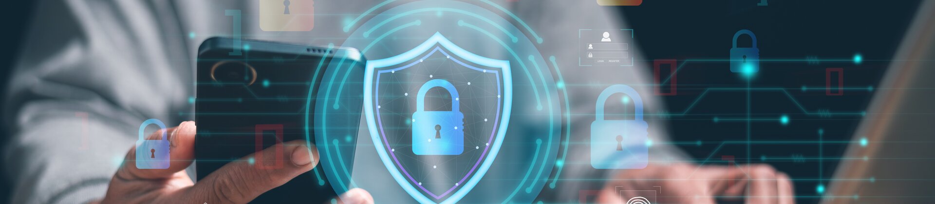 Weiterbildung Schutz vor Cybercrime und Existenzbedrohung: Person nutzt Laptop und Smartphone mit digitalen Symbolen für IT-Sicherheit.
