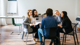 Business people having a team meeting in office