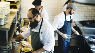 Group of chefs working in the kitchen